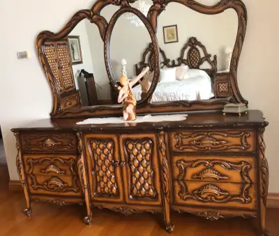This stunning, vintage bedroom dresser with ornate detailing and triple mirrors is a statement piece...