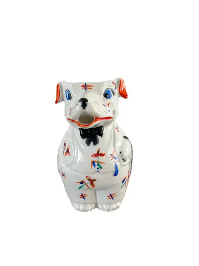 This is a rare German art deco porcelain dog Pitcher from the 1920/30s. It features a gentleman dog...