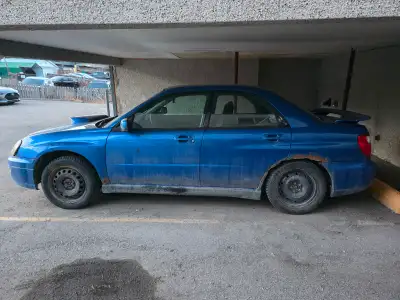 2004 Subaru Impreza WRX. The car is currently not drivable. Needs new transmission. Recently replace...