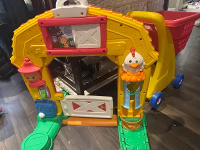 interactive toy for toddlers with lots of different activities. The cart features a variety of colou...