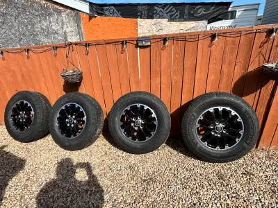 I'm selling a set of Toyota Tundra 2022+ TRD off-road rims with Michelin LTX Trail tires, sized at 2...