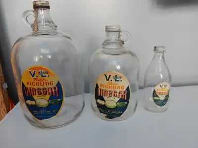 3 vintage vinegar jugs. Made by Vinegars Limited-V.L. Brand in Saskatoon. 160 fluid ounces, 80 fluid...
