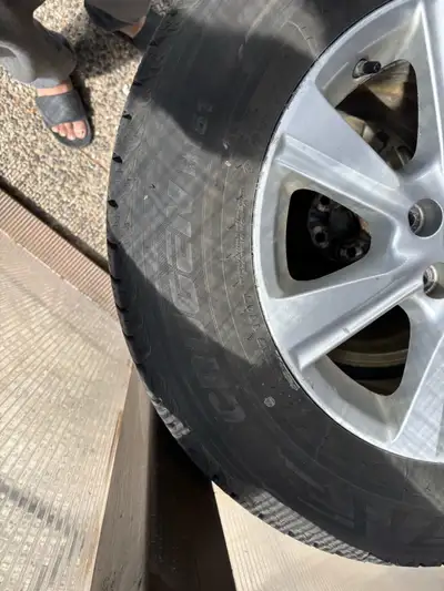 4 all weather tires kumho crugen size 245 65R17 , on original Toyota Highlander alloy rims with 114....