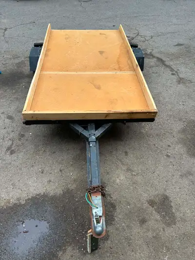 Tilt and load trailer works well 4.5 ft wide 8 ft long new lights all work well tire r new last year...