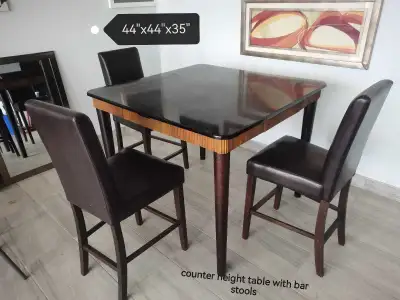 Counter Height Table with 3 Stools and has 4 drawers, View more
