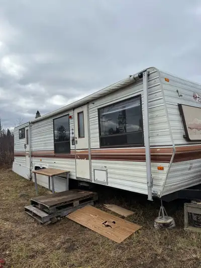 33 ft camper trailer, 3 bunks and queen in back, pull out couch and kitchen table turns into bed, sl...