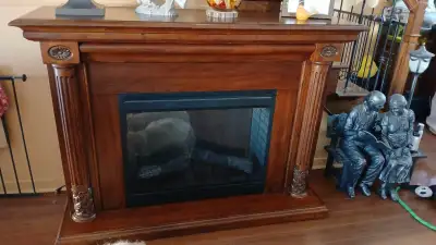 Très beau meuble foyer électrique bois solide brun avec manette acheté chez Maison Chaleur Confort N...