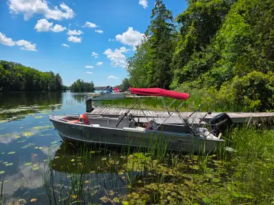 Boat, trailer, fish finder, down riggers with 2023 Suzuki four strokes 50 HP with low hours, under 2...