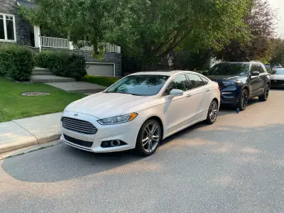 Fully loaded 2013 Ford Ford Fusion Titanium equipped with Sync nav/entertainment system. New tires a...
