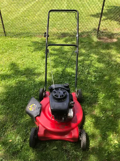 Tame your lawn with this reliable Yardworks gas-powered lawn mower, perfect for maintaining a tidy y...