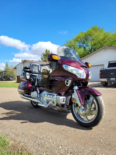 ABS, GPS, heated seat and hand grips, trailer hitch, cover, extra rear rim. Stored inside.
