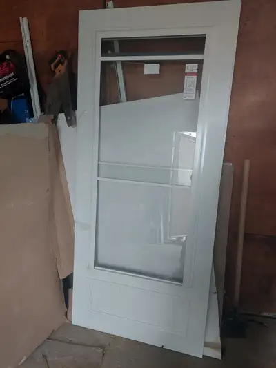 Storm door 35×79 white new $130 416.818.6885, View more