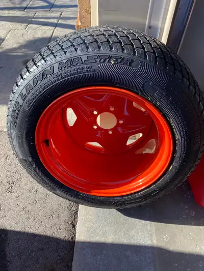 2 Brand New Kubota ZD rear rim and tire assembly 26-12.00-16 Grass Master tires. Selling as a pair....
