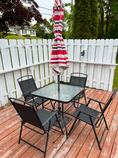 Glass topped deck table, chairs, umbrella and umbrella stand, View more