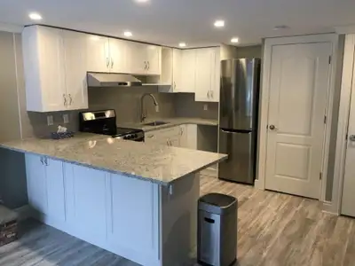 Beautiful walk out basement apartment with 2 bdrm, and 26’ x 12’ foot deck. Gorgeous private yard. G...