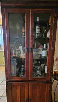 Glass door wood cabinet ( part of an entertainment unit)