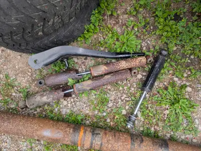$100 for all the parts shown (front shocks and control arm, drive shaft, sway bar, rear shock all to...