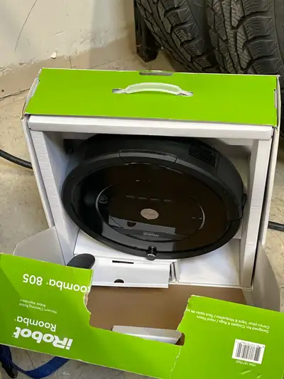 This is a used iRobot Roomba 805 vacuum cleaning robot designed for carpets, rugs, and hard floors,...
