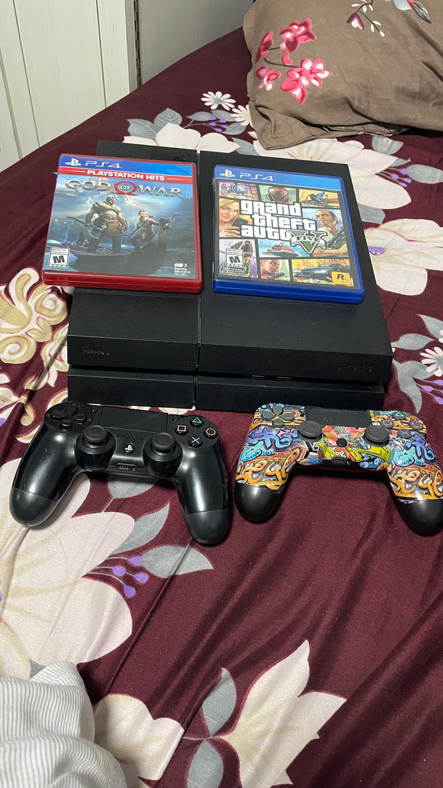 PS 4 500 GB with 2 remotes and 2 games ( GTA 5) ( GOD OF WAR )  in Sony Playstation 4 in Hamilton