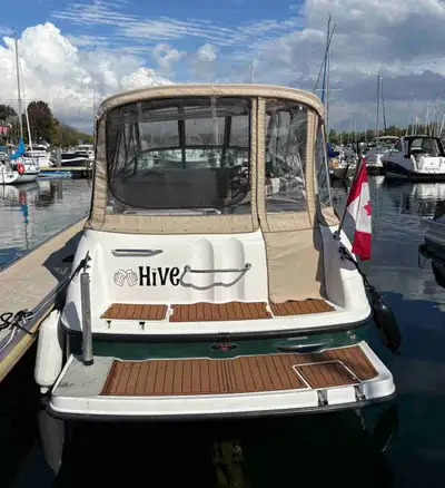 This pre-owned Chaparral boat features a spacious cockpit area with comfortable seating, a removable...