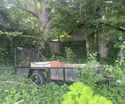 Reinforced steel homemade single axle utility trailer with steel mesh rear gate. Very solid. We don’...