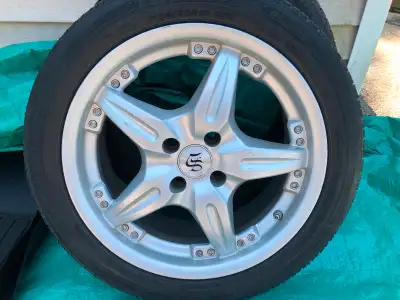 4 Bridgestone Turanza EL400 tires mounted on rims with. TPMS sensors. 4x100 bolt pattern. $150 OBO