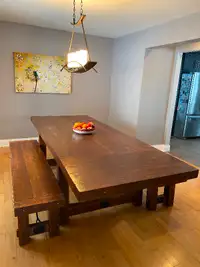 Hand-built solid wood harvest table with benches.