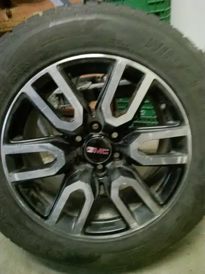 Wintertracker mud and snow tires on 20 inch alloy GMC rims, 275 60 20 tires, pressure sensors instal...