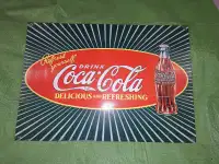 Metal coca cola advertising sign