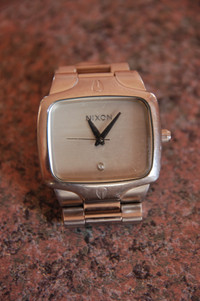 NIXON YES IT'S REAL THE PLAYER WATCH, REAL DIAMOND AT 6 O'CLOCK.