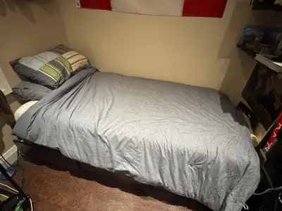 Used black twin bed frame with 3 built in storage drawers, offering plenty of space for storing clot...