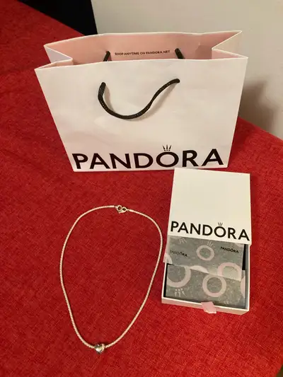 Hi, Selling a brand new authentic Pandora silver necklace and heart charm. Believe this retailed for...