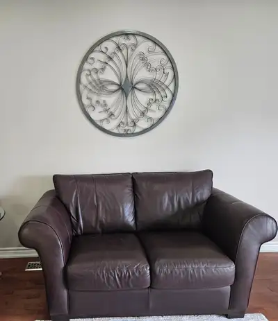 Brown love seats and sofa, View more
