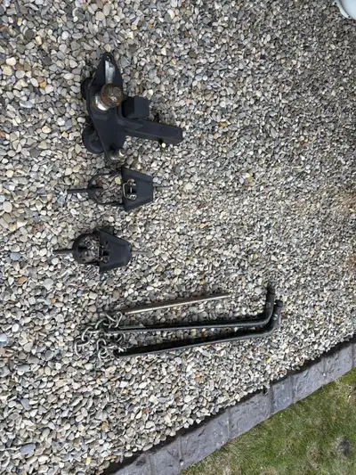 This is a used Husky weight distribution hitch designed to improve towing stability and control. The...