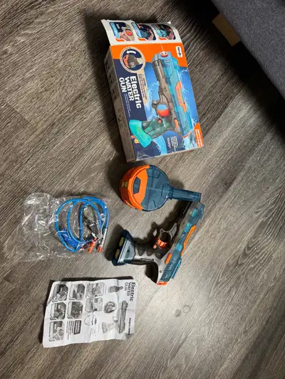 Electric water toy gun. Tried once. Good as new