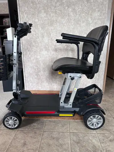 Buzz Around Carry On Scooter Golden GB120 Easy access 12.5 AH battery Weighs only 47.5 lbs 12” heigh...