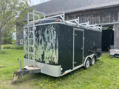 Large double axel trailer Upgraded axes, 5000 lbs per axel ARear and side doors Aluminum roof racks...