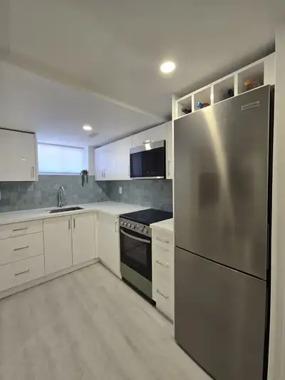 Super cute, super cozy, fully renovated, never lived in lower level bachelor suite available on a qu...
