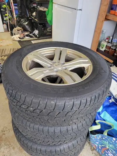 4 MotorMaster Winter Edge tires on aftermarket rims. Tire size is 245/65R17. Rim bolt pattern is 5x1...