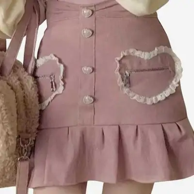 Cute kawaii pink bow suspender skirt. Straps detachable with a bow on the shoulders. Has two tiny zi...