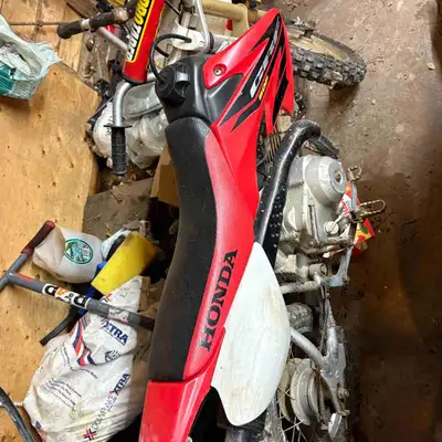 This 2003 Honda CRF 50 ! Needs some tlc. No front brakes. Starts and stops