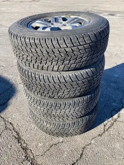 Honda CRV Alloy RIMS with Winter tires installed and balanced. Tires have lots of tread (about 80% t...