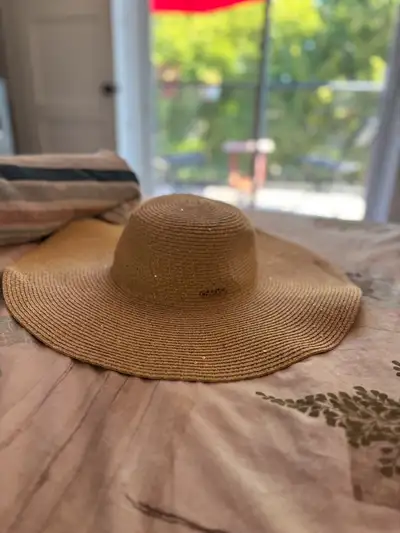 woman’s floppy beach hat, Calvin Klein, View more