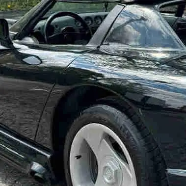1995 Dodge Viper, a first-generation beauty that roars with an 8.0L V10 engine and classic styling....