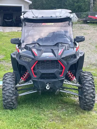 Polaris RZR XP 1000 black and red. Good condition. Comes with winch and plow. Low kms. $18000 obo