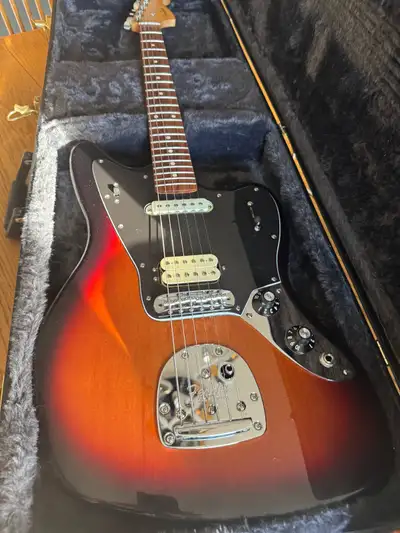 I'm selling my used Fender Jaguar! This electric guitar boasts a beautiful sunburst finish and is in...