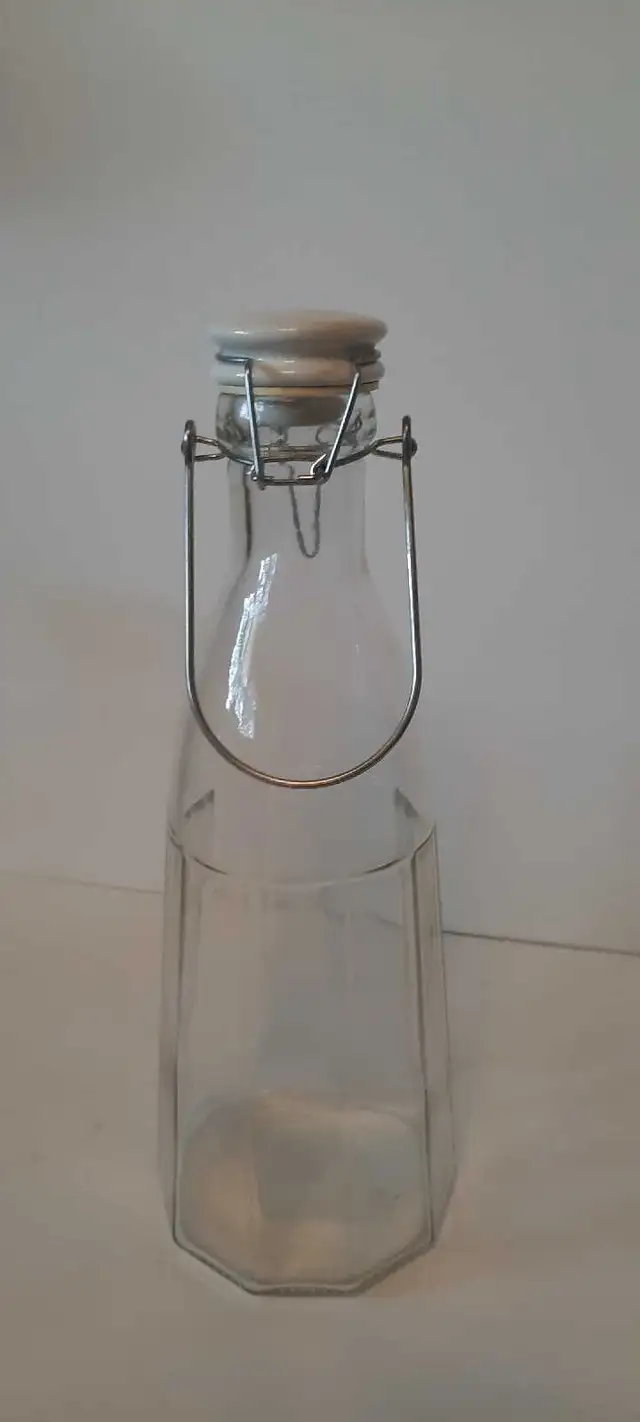 Glass Bottle with Ceramic and Metal Flip Top Lid