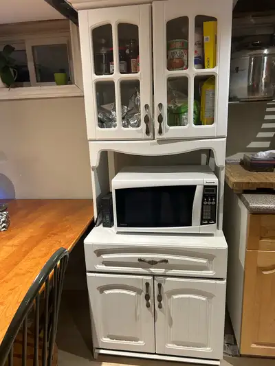 Rustic white microwave stand with glass upper cabinet and lower drawer and cabinet in very good cond...