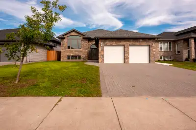A rare opportunity to live in a beautifully finished, move-in-ready apartment in a home that combine...