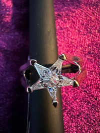 Lady's Custom 18KT white gold star shaped ring.